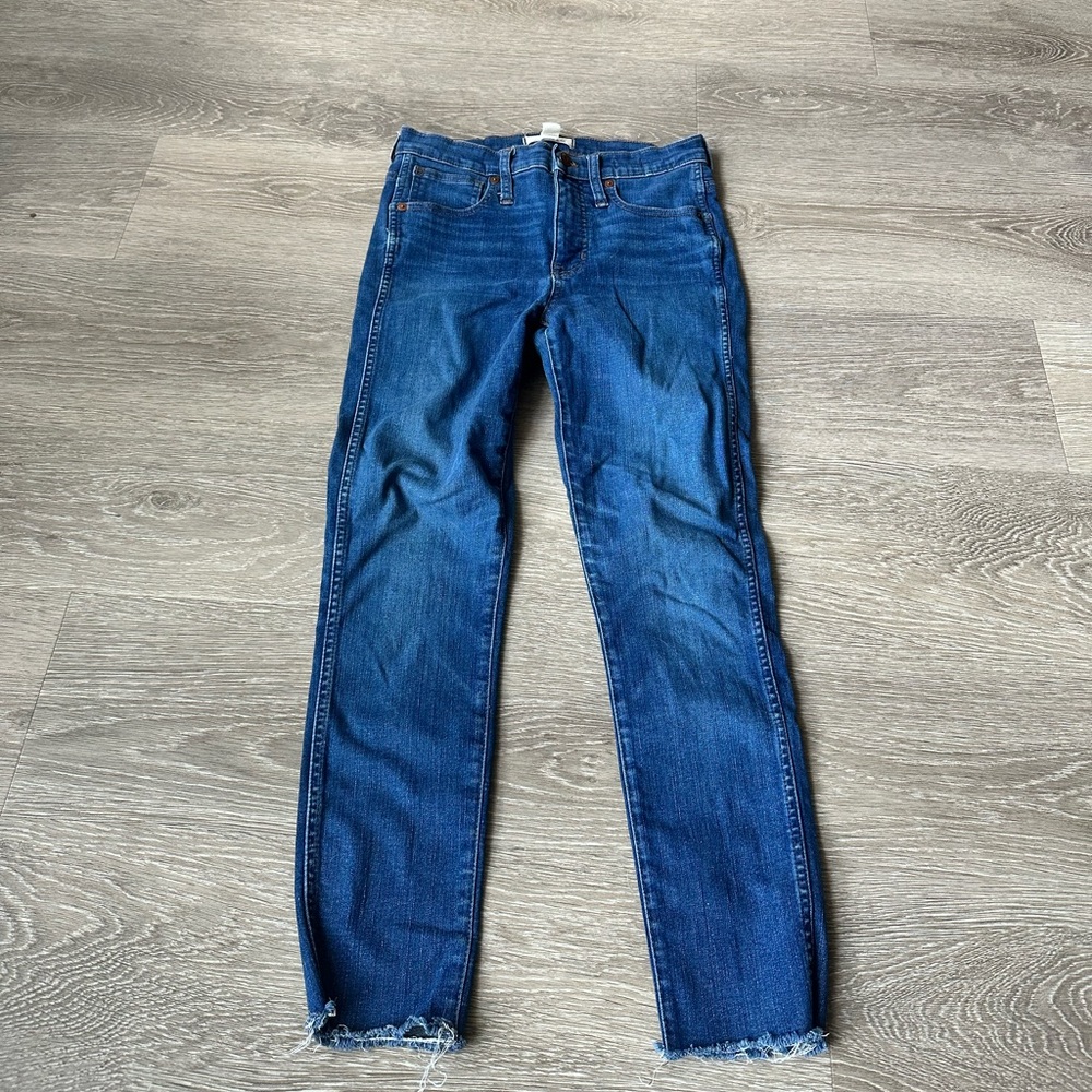 Lightly worn high rise blue jeans with a skinny fit from Madewell size 27.